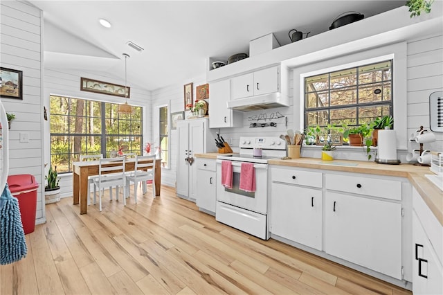 kitchen featuring under cabinet range hood, white electric stove, white cabinets, light wood finished floors, and vaulted ceiling