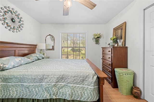 bedroom with light wood-type flooring and a ceiling fan