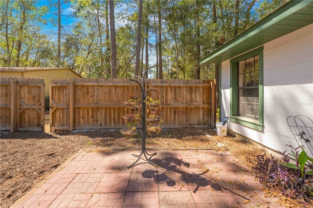 view of patio / terrace featuring fence