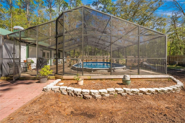 view of yard with a fenced in pool, a patio area, a lanai, and fence