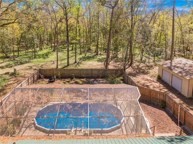 view of swimming pool with a fenced backyard