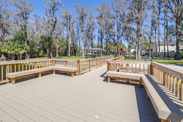 wooden terrace featuring a gazebo