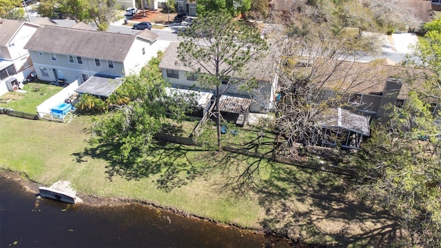 birds eye view of property with a residential view and a water view