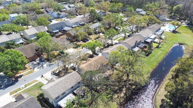 birds eye view of property with a residential view and a water view