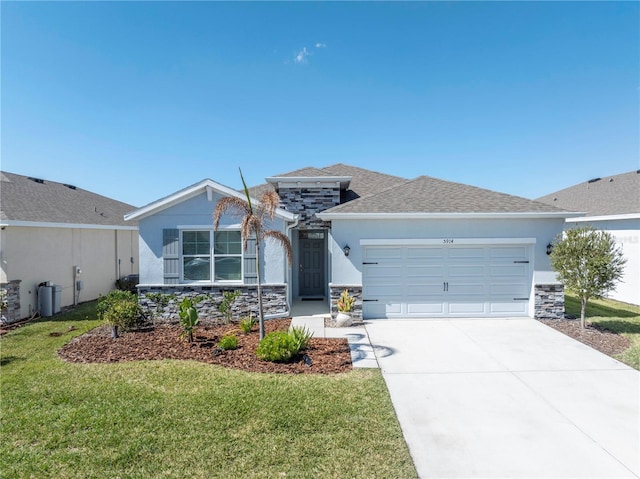 view of front of house featuring stone siding, a garage, driveway, and a front yard