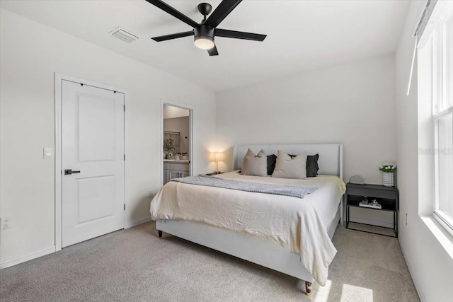33064 Tulip Petal Ln, Wesley Chapel, FL 33545 - bedroom with carpet, a ceiling fan, and connected bathroom