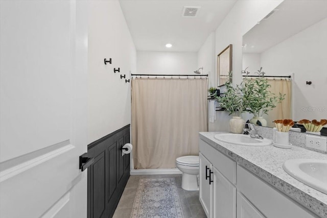 33064 Tulip Petal Ln, Wesley Chapel, FL 33545 - bathroom with double vanity, curtained shower, tile patterned flooring, and recessed lighting