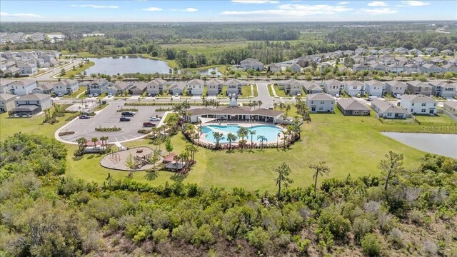 33064 Tulip Petal Ln, Wesley Chapel, FL 33545 - aerial view of residential area featuring a nearby body of water and a pool area