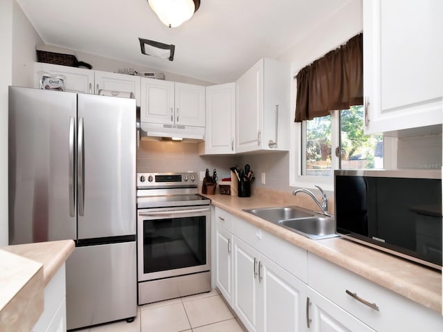 kitchen with under cabinet range hood, a sink, white cabinetry, stainless steel appliances, and light countertops