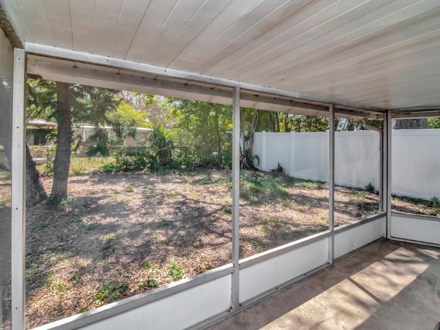 unfurnished sunroom featuring wood ceiling