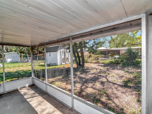 unfurnished sunroom with wooden ceiling