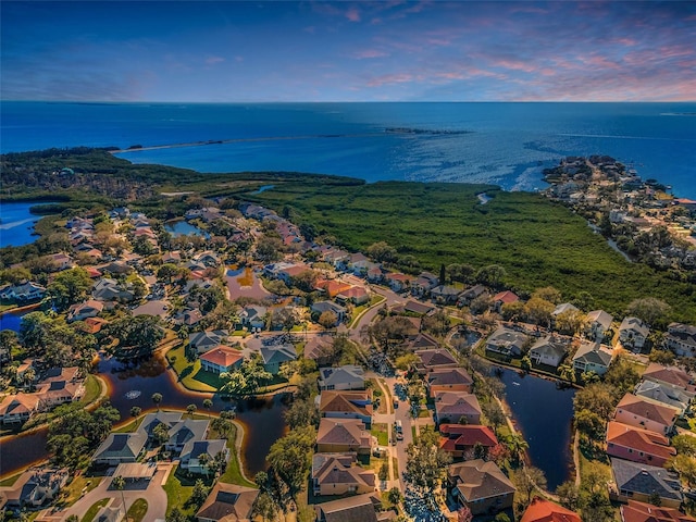 bird's eye view featuring a residential view and a water view