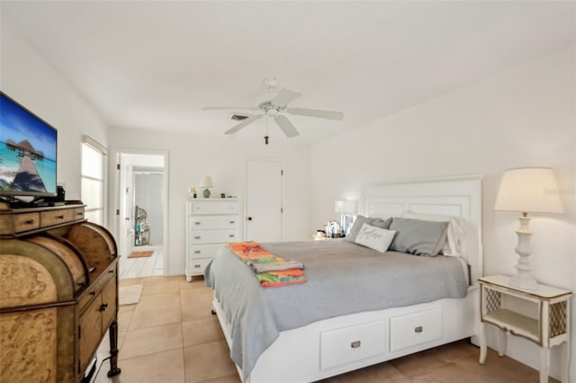 bedroom with light tile patterned floors, visible vents, and ceiling fan