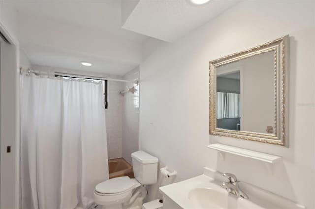 bathroom with toilet, vanity, and shower / bath combination with curtain