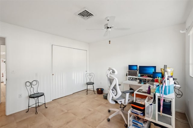 office space featuring a ceiling fan and visible vents