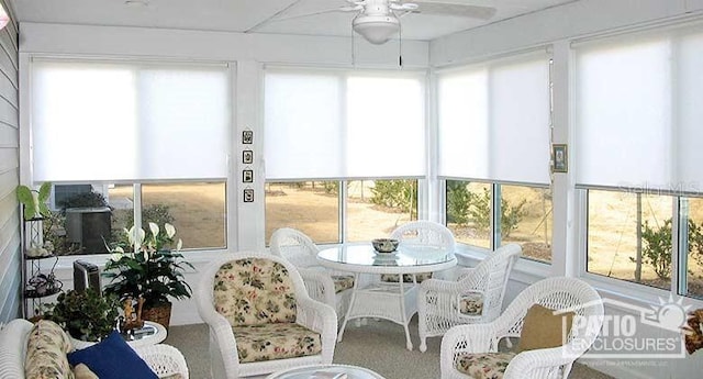 sunroom featuring ceiling fan