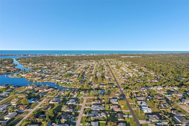 birds eye view of property featuring a water view and a residential view