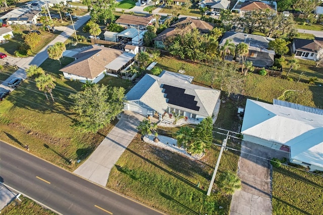 birds eye view of property with a residential view