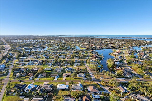 bird's eye view with a water view and a residential view