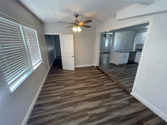 645 38th Ave S, Saint Petersburg, FL 33705 - spare room featuring dark wood-type flooring, a ceiling fan, and baseboards