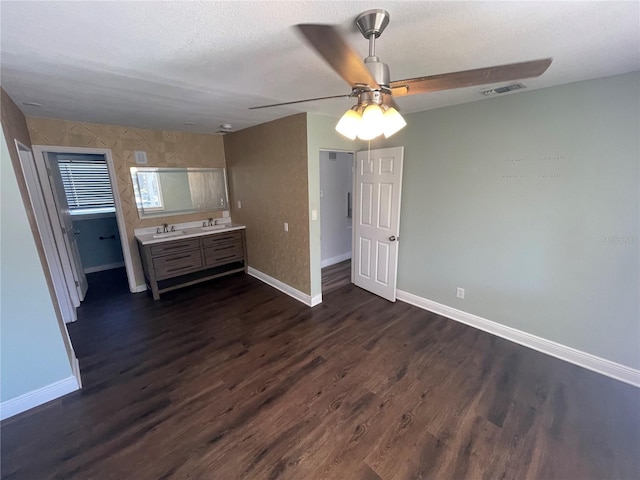 645 38th Ave S, Saint Petersburg, FL 33705 - unfurnished bedroom with a sink, baseboards, and dark wood finished floors