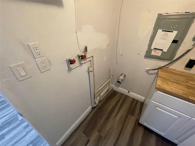 645 38th Ave S, Saint Petersburg, FL 33705 - laundry room featuring baseboards and dark wood-style flooring