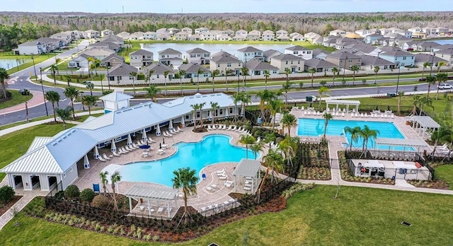 birds eye view of property with a residential view