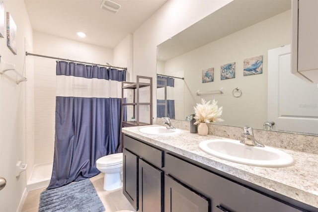 bathroom with a shower with shower curtain, toilet, visible vents, and a sink