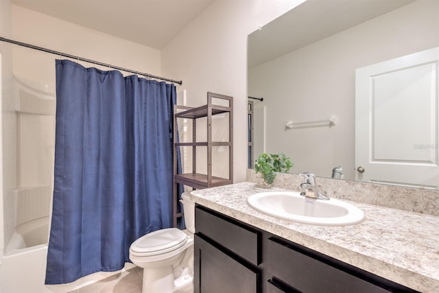 full bath with tile patterned floors, shower / bath combo with shower curtain, toilet, and vanity