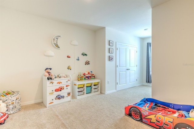 carpeted bedroom featuring baseboards