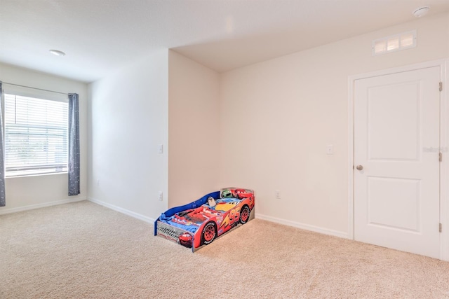 recreation room with visible vents, carpet floors, and baseboards