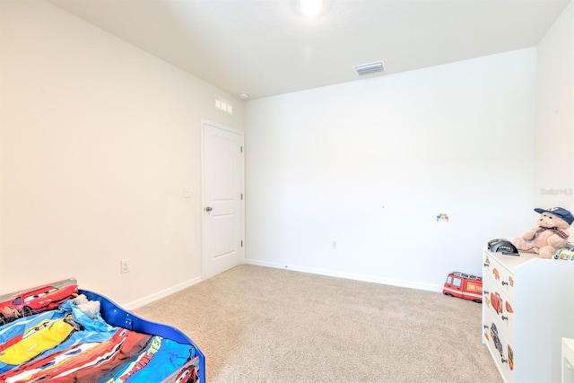 bedroom with carpet, visible vents, and baseboards