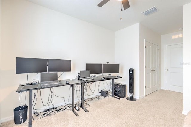 office area with carpet flooring, baseboards, and visible vents