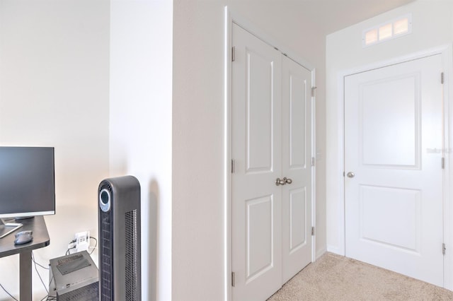 carpeted home office featuring visible vents