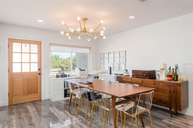 dining room featuring recessed lighting, light wood finished floors, and a chandelier