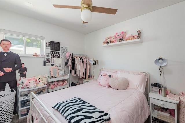 bedroom featuring ceiling fan and wood finished floors