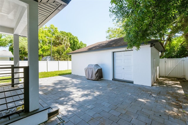 garage featuring a gate and fence