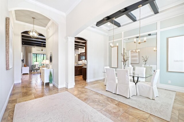 dining room with beam ceiling, ceiling fan with notable chandelier, coffered ceiling, and baseboards