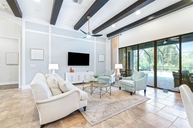 living room featuring beam ceiling, baseboards, and ceiling fan