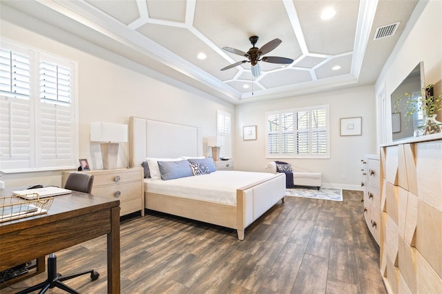 bedroom with visible vents, coffered ceiling, dark wood finished floors, crown molding, and baseboards