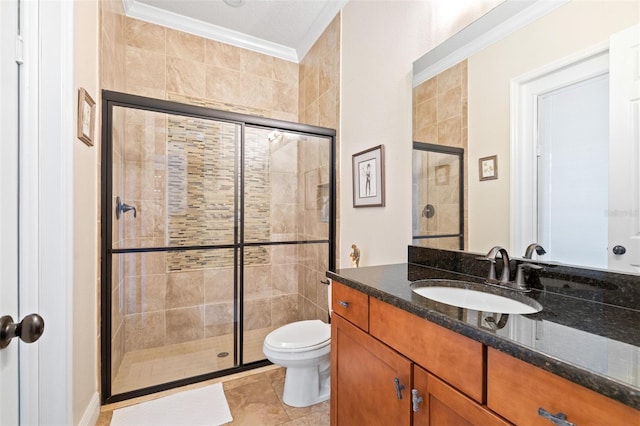 full bathroom featuring vanity, toilet, a stall shower, and crown molding