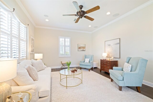 living area with crown molding, baseboards, recessed lighting, a ceiling fan, and dark wood-style flooring