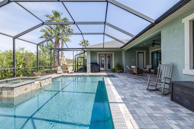 view of swimming pool featuring grilling area, glass enclosure, french doors, a patio area, and a ceiling fan