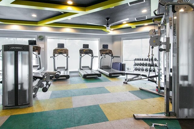 exercise room featuring recessed lighting, a ceiling fan, and visible vents