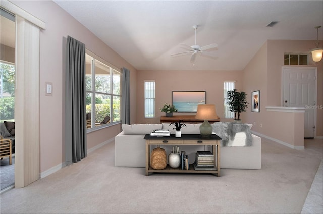 1020 New Winsor Loop Unit 46, Sun City Center, FL 33573 - carpeted living room with a ceiling fan, healthy amount of natural light, baseboards, and lofted ceiling