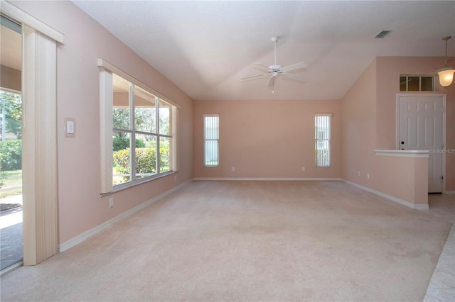 1020 New Winsor Loop Unit 46, Sun City Center, FL 33573 - spare room with a ceiling fan, light colored carpet, lofted ceiling, and baseboards