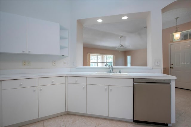 1020 New Winsor Loop Unit 46, Sun City Center, FL 33573 - kitchen featuring stainless steel dishwasher, a sink, ceiling fan, light countertops, and white cabinetry