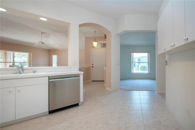 1020 New Winsor Loop Unit 46, Sun City Center, FL 33573 - kitchen featuring stainless steel dishwasher, a sink, arched walkways, healthy amount of natural light, and recessed lighting