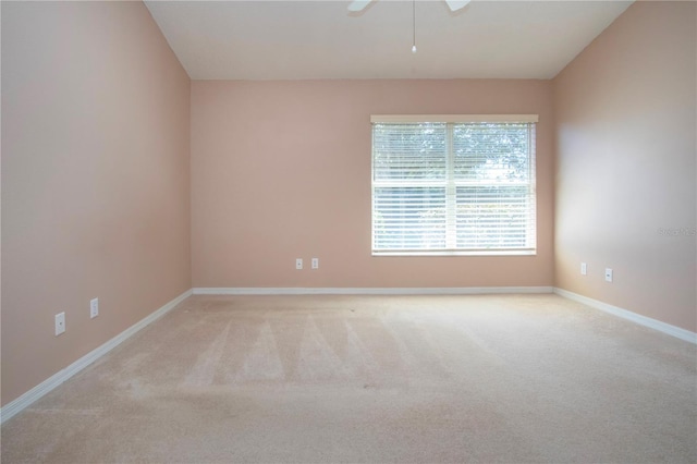 1020 New Winsor Loop Unit 46, Sun City Center, FL 33573 - unfurnished room with light carpet, baseboards, and ceiling fan