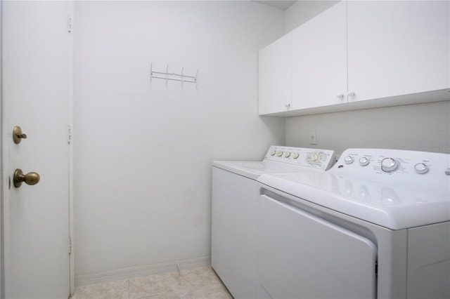 1020 New Winsor Loop Unit 46, Sun City Center, FL 33573 - laundry room with cabinet space, independent washer and dryer, baseboards, and light tile patterned floors